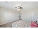 Bright bedroom with carpeted floors and ceiling fan at 522 Spring View Dr, Woodstock, GA 30188