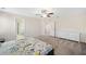 Bright bedroom with a large window, ceiling fan and a white dresser for ample storage at 522 Spring View Dr, Woodstock, GA 30188