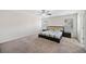 Spacious bedroom featuring plush carpeting, a ceiling fan, and natural light from two windows at 522 Spring View Dr, Woodstock, GA 30188