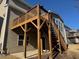 A spacious, wooden deck overlooks the backyard, complete with stairs at 522 Spring View Dr, Woodstock, GA 30188
