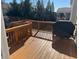 Wooden deck with built-in seating and grill at 522 Spring View Dr, Woodstock, GA 30188