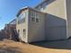 Back exterior view featuring sunroom and wood stairs at 522 Spring View Dr, Woodstock, GA 30188