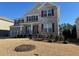 Charming two-story home featuring gray brick, complementary shutters, and a well-manicured front lawn at 522 Spring View Dr, Woodstock, GA 30188
