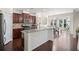 Open kitchen with stainless steel appliances and an adjacent dining area at 522 Spring View Dr, Woodstock, GA 30188