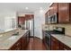 Modern kitchen with stainless steel appliances and granite countertops at 522 Spring View Dr, Woodstock, GA 30188