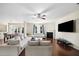 Bright, open living room with hardwood floors, fireplace, and modern furniture at 522 Spring View Dr, Woodstock, GA 30188