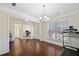Open-concept room featuring hardwood floors and multiple doorways at 522 Spring View Dr, Woodstock, GA 30188