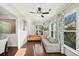 Bright and airy living room features hardwood floors, modern furnishings, and ample natural light at 522 Spring View Dr, Woodstock, GA 30188