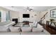 Spacious living room with a fireplace and a staircase in view at 522 Spring View Dr, Woodstock, GA 30188