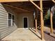 Concrete patio under deck with access to basement at 522 Spring View Dr, Woodstock, GA 30188