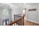 Upstairs hallway with hardwood floors and view of the entryway at 1358 Wynbrook Trce, Smyrna, GA 30126