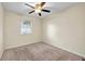Simple bedroom with carpeted floors and a ceiling fan at 2234 Cherokee Valley Dr, Lithonia, GA 30058