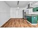Modern kitchen with stainless steel appliances and green cabinets at 2234 Cherokee Valley Dr, Lithonia, GA 30058