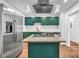 Modern kitchen featuring stainless steel appliances and green cabinets at 2234 Cherokee Valley Dr, Lithonia, GA 30058