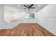 Bright living room featuring hardwood floors and a ceiling fan at 2234 Cherokee Valley Dr, Lithonia, GA 30058