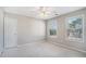 Bright bedroom with neutral walls, ceiling fan, and carpet at 1016 Madeline Ct, Loganville, GA 30052