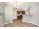 Kitchen with dark brown cabinets, granite countertops, and stainless steel appliances at 1016 Madeline Ct, Loganville, GA 30052