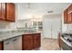 Spacious kitchen featuring granite countertops, stainless steel appliances, and ample cabinetry at 1016 Madeline Ct, Loganville, GA 30052