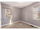 Bright bedroom featuring gray walls, carpet, and window with blinds at 2196 Knoll Dr, Decatur, GA 30032