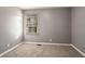 Simple bedroom with gray walls, carpet, and one window at 2196 Knoll Dr, Decatur, GA 30032