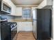 Kitchen with stainless steel appliances and white cabinets at 2196 Knoll Dr, Decatur, GA 30032