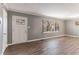 Living room with hardwood floors and an exterior door at 2196 Knoll Dr, Decatur, GA 30032