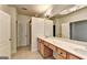 Double vanity, large mirror, and tiled floor at 2790 Laurel Valley Trail, Buford, GA 30519