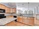 Open kitchen features granite counters and island at 2790 Laurel Valley Trail, Buford, GA 30519