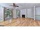 Spacious living room with hardwood floors, fireplace and access to balcony at 2790 Laurel Valley Trail, Buford, GA 30519