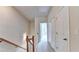 Upstairs hallway with carpet and access to bedrooms at 2790 Laurel Valley Trl, Buford, GA 30519