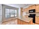 Bright kitchen boasts granite counters and ample cabinet space at 2790 Laurel Valley Trl, Buford, GA 30519