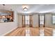 Hardwood floor living room with kitchen passthrough at 2790 Laurel Valley Trl, Buford, GA 30519