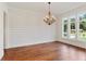 Bright dining room features hardwood floors, shiplap wall, and a chandelier at 600 Autumn Ln, Marietta, GA 30068