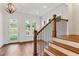 Bright entryway with hardwood floors, staircase and front door at 600 Autumn Ln, Marietta, GA 30068