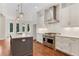 Modern kitchen with white cabinets, quartz countertops, and stainless steel appliances at 600 Autumn Ln, Marietta, GA 30068