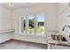 Laundry room with granite countertops and a large window at 600 Autumn Ln, Marietta, GA 30068