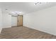 Finished basement room with sliding barn door and hardwood floors at 607 Ann Ct, Woodstock, GA 30188