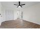 Bedroom with hardwood floors, white louvered doors and access to a deck at 607 Ann Ct, Woodstock, GA 30188