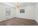 Bright dining room with hardwood floors and modern chandelier at 607 Ann Ct, Woodstock, GA 30188