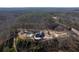 Aerial view of house, pool, and expansive wooded lot at 1150 Brushy Mountain Rd, Rockmart, GA 30153