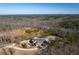 Aerial view of home with a long driveway and pool at 1150 Brushy Mountain Rd, Rockmart, GA 30153