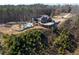 Aerial view of home showcasing wooded acreage at 1150 Brushy Mountain Rd, Rockmart, GA 30153