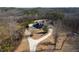 Aerial view of home with circular driveway and wooded setting at 1150 Brushy Mountain Rd, Rockmart, GA 30153