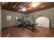 Basement gym with wood flooring, equipment, and natural light at 1150 Brushy Mountain Rd, Rockmart, GA 30153