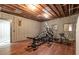 Finished basement gym with wood flooring and exercise equipment at 1150 Brushy Mountain Rd, Rockmart, GA 30153