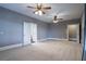 Spacious bedroom with carpet flooring and ceiling fans at 1150 Brushy Mountain Rd, Rockmart, GA 30153