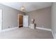 Well-lit bedroom with carpeted floors and neutral-toned walls at 1150 Brushy Mountain Rd, Rockmart, GA 30153