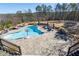 Inviting swimming pool with large patio and scenic backdrop at 1150 Brushy Mountain Rd, Rockmart, GA 30153