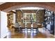 Open dining area with stone feature wall and rustic wooden table at 1605 Brandon Hall Dr, Atlanta, GA 30350