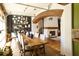 Long farmhouse dining table in a sunlit, open concept space at 1605 Brandon Hall Dr, Atlanta, GA 30350